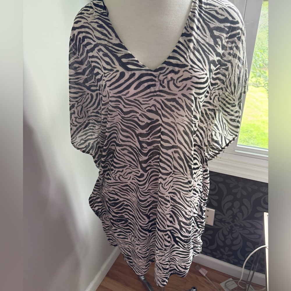 Zebra pattern swimsuit coverup.